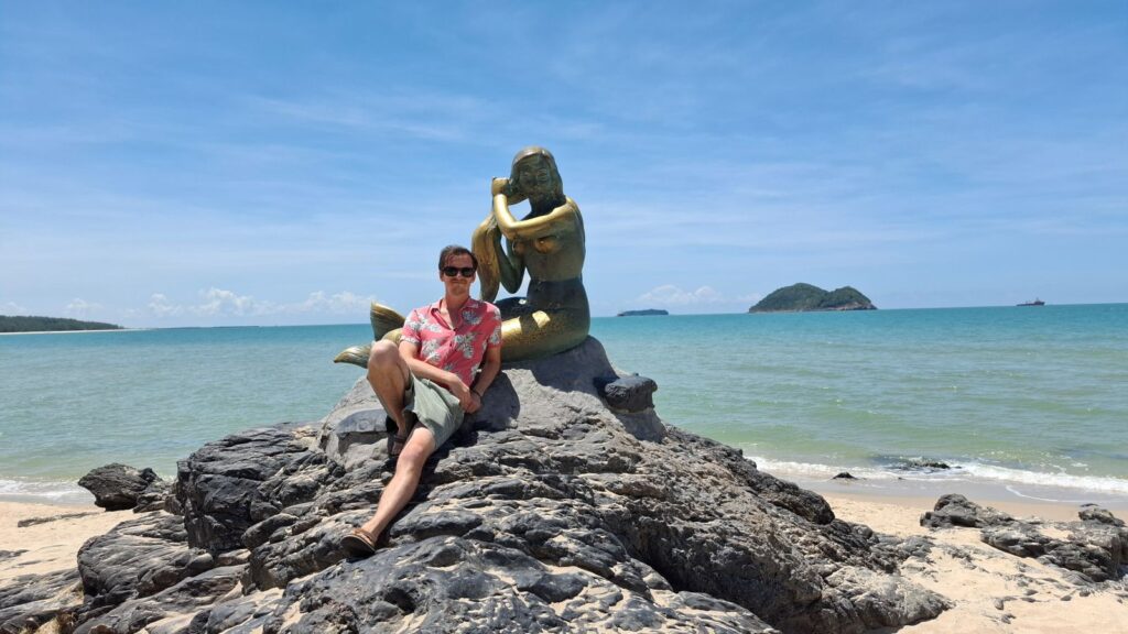 sandaltanman at mermaid statue in songkhla